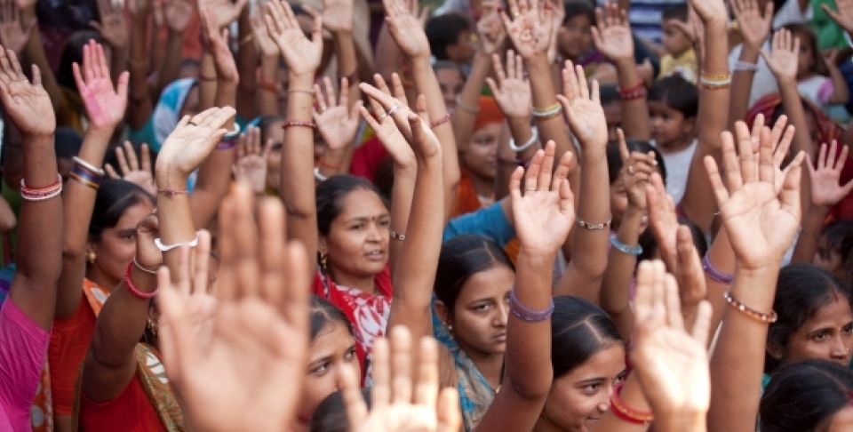 Community members in Gujarat, India, participate in discussions after watching video documentaries screened by the Self Employed Women's Association of India, 2010. (Gates Foundation)