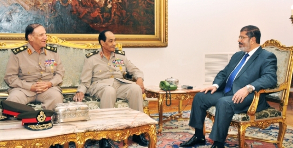Sami Enan, left, Hussein Tantawi, center, and Egyptian President Mohamed Morsi meet at the Presidential Palace in Cairo, Egypt, Tuesday, Aug. 14, 2012. (AP Photo/Middle East News Agency, HO)