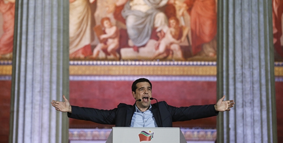 In this photo taken in January 2015, leader of SYRIZA left-wing party Alexis Tsipras speaks to his supporters after his election victory outside Athens University Headquarters. (AP Photo/Petros Giannakouris)