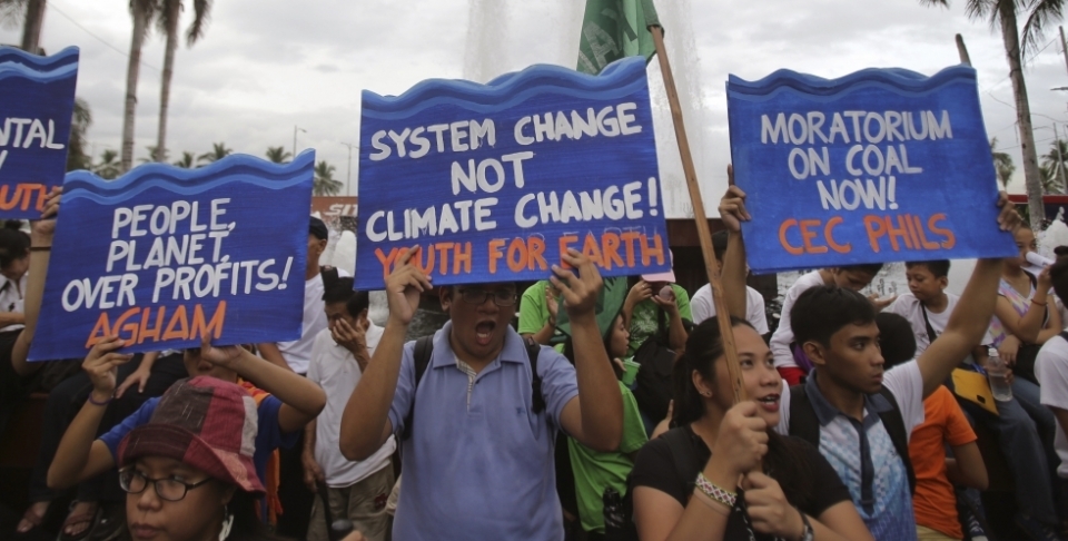 Filipino activists shout slogans during a play depicting the effects of climate change as they join the Climate Solidarity Prayer March in Manila back in November 2015. (AP Photo/Aaron Favila)
