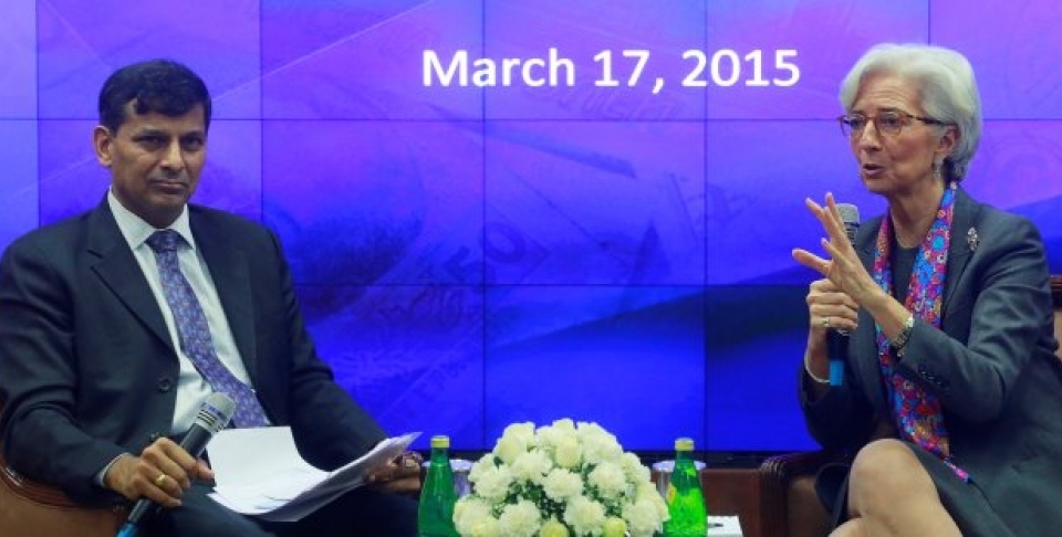 Managing Director of the IMF Christine Lagarde speaks as Governor of Reserve Bank of India Raghuram Rajan looks on during an event at the RBI headquarters in Mumbai, India, March 17, 2015. Lagarde was in the country on a two-day visit. (AP Photo/Rafiq Maqbool)