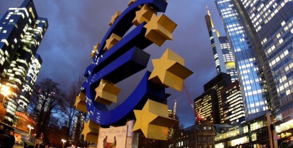 The Euro sculpture stands in front of the European Central Bank, right, in Frankfurt, Germany. (AP Photo/Michael Probst)