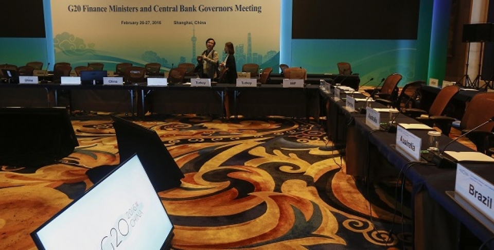 Chinese journalists view the meeting room one day before the start of the G20 Finance Ministers and Central Bank Governors Meeting at the Pudong Shangri-la Hotel in Shanghai, China, Thursday, Feb. 25, 2016. (Rolex Dela Pena/Pool via AP)