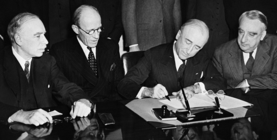 Secretary of State James F. Syrnes signs agreement for $4,400,000,000 loan to Great Britain by the United States during ceremony at State Department in Washington on June 12, 1945. (AP Photo)
