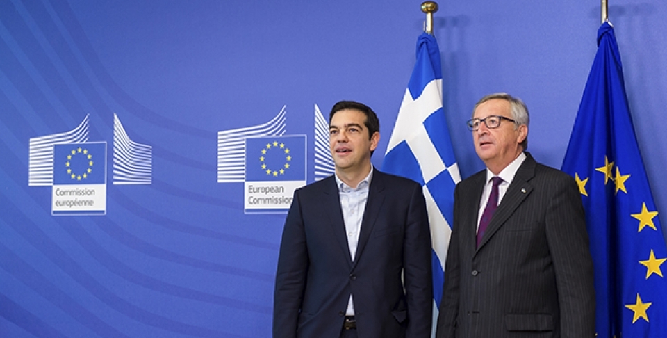 European Commission President Jean-Claude Juncker, right, stands with Greece's Prime Minister Alexis Tsipras upon his arrival at the European Commission headquarters in Brussels Wednesday, Feb. 4, 2015. (AP Photo/Geert Vanden Wijngaert)