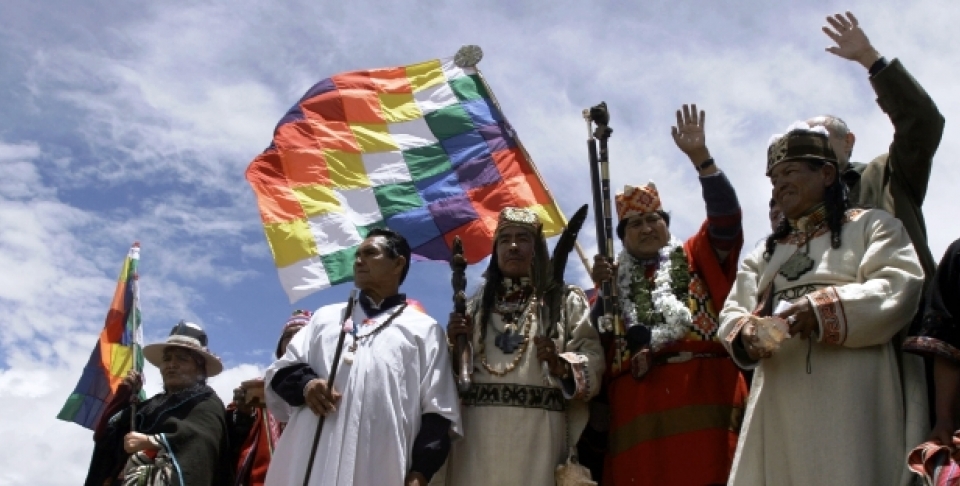 Holding the symbols of indigenous power, Bolivian President-elect Evo Morales, 2nd right, waves to supporters. (AP Photo/Dado Galdieri)