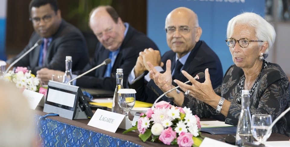 International Monetary Fund Managing Director Christine Lagarde speaks at the Bretton Woods Committee on October 10, 2018 in Bali, Indonesia. Masood Ahmed, president of Center for Global Development and Thomas Bernes, a distinguished fellow at CIGI sit to her left. (IMF Staff Photo/Stephen Jaffe)