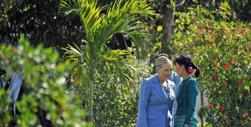 Aung San Suu Kyi, right, talks with visiting U.S. Secretary of State Hillary Clinton at a private residence in Yangon, Myanmar in 2011. (AP Photo/Soe Than Win, Pool)
