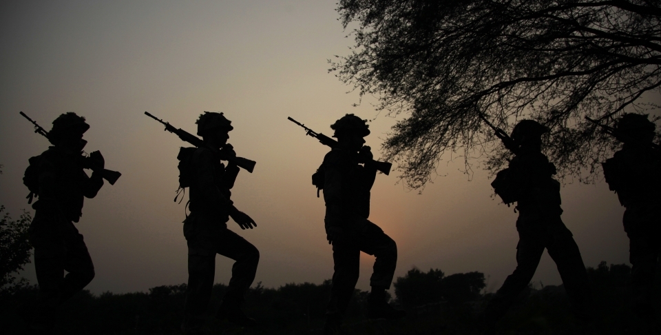 Soldiers patrol the India-Pakistan border (AP Photo/Channi Anand)