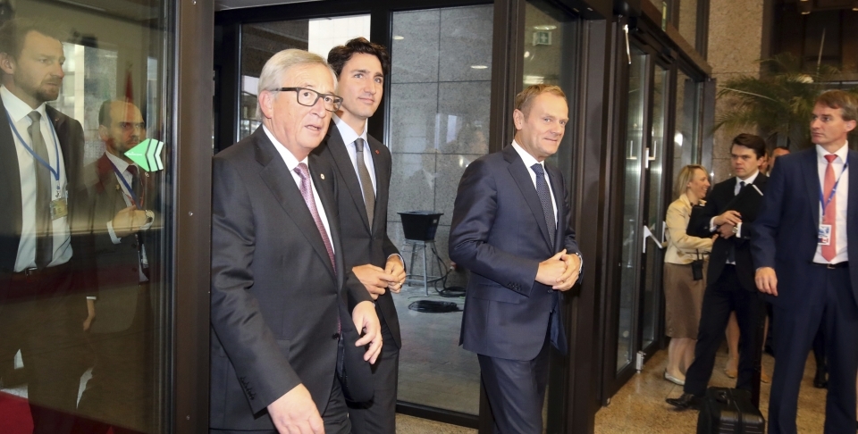 Canadian Prime Minister Justin Trudeau, left, European Commission President Jean-Claude Juncker, center, and European Council President Donald Tusk, right (AP Photo/Olivier Matthys)