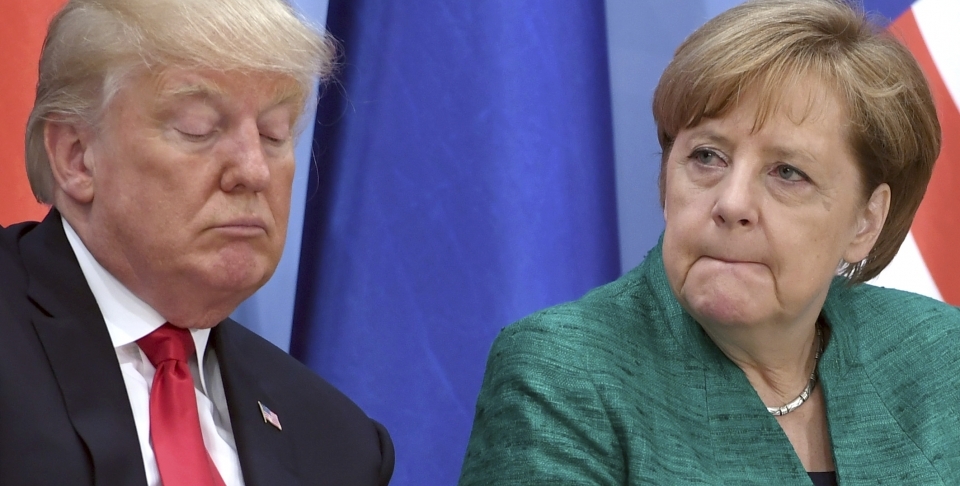 US President Donald Trump and German Chancellor Angela Merkel (Michael Kappeler/Pool Photo via AP)