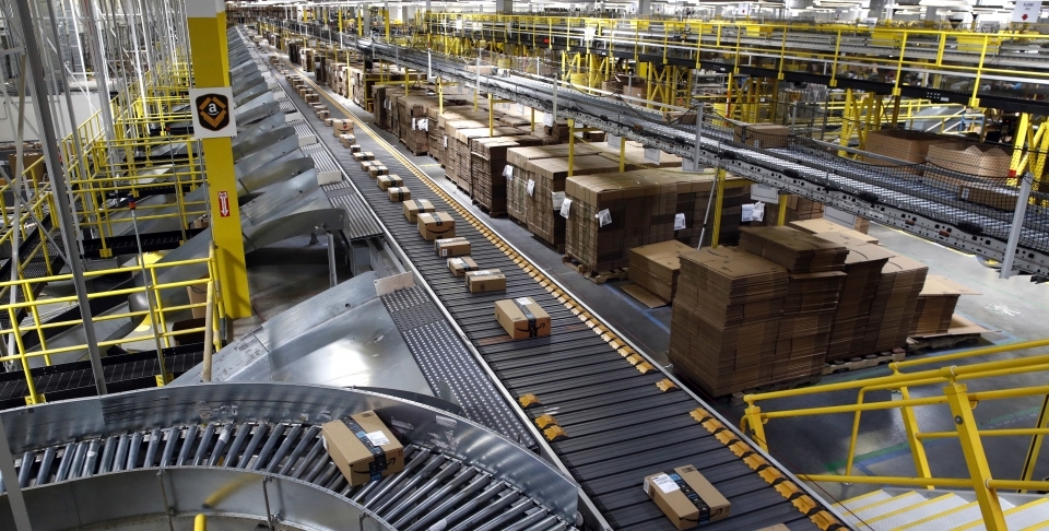 Packages ride on a conveyor system at an Amazon fulfillment center in Baltimore. (AP Photo/Patrick Semansky)