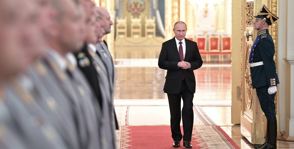 Russian President Vladimir Putin walks in a hall during a meeting with senior military officers in the Kremlin. (Alexei Nikolsky, Kremlin Pool Photo via AP)