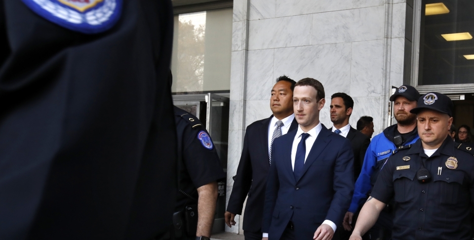 Facebook CEO Mark Zuckerberg leaves the Rayburn House Office Building after testifying on Capitol Hill in Washington on April 11, 2018. (AP Photo/Jacquelyn Martin)