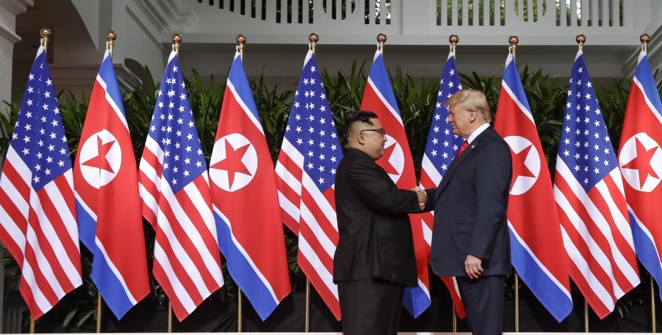 US President Donald Trump shakes hands with North Korea leader Kim Jong Un on June 12, 2018 in Singapore. (AP Photo/Evan Vucci)
