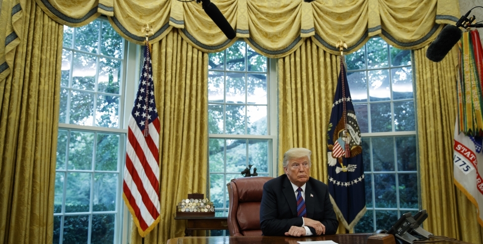 President Donald Trump listens during a phone call with Mexican President Enrique Pena Nieto about a trade agreement between the United States and Mexico on August 27, 2018. (AP Photo/Evan Vucci)