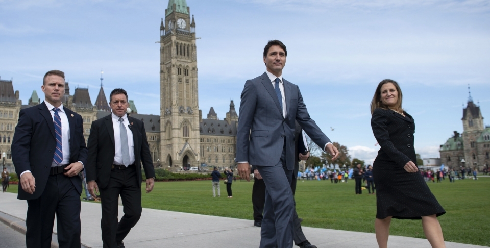 Prime Minister Justin Trudeau and Minister of Foreign Affairs Chrystia Freeland walk to a press conference on the USMCA trade deal