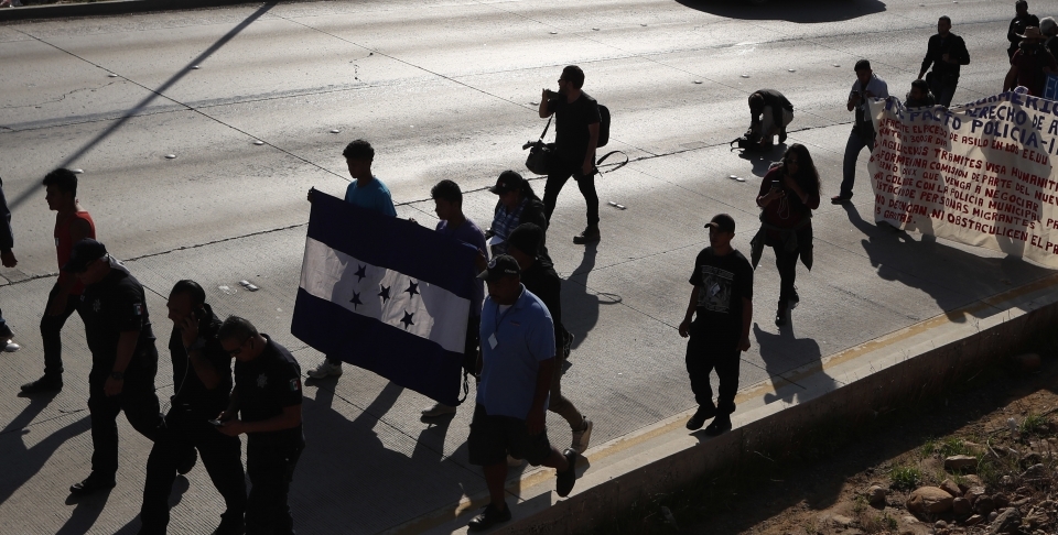 On December 11, 2018, Honduran migrants marched to the US consulate in Tijuana, Mexico, calling for authorities to speed up the asylum application process. (AP Photo/Moises Castillo)