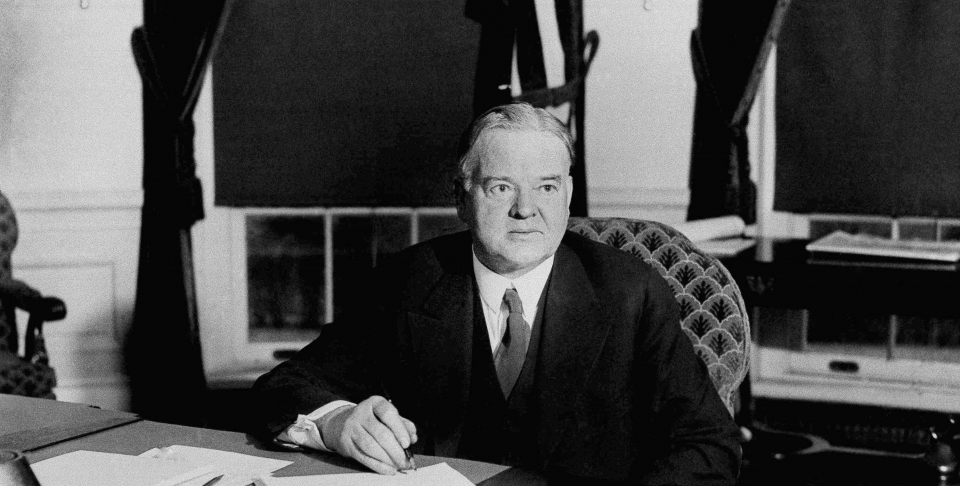 President Herbert Hoover signs unemployment and drought relief bills during the Great Depression. Dec. 20, 1930. (AP Photo)