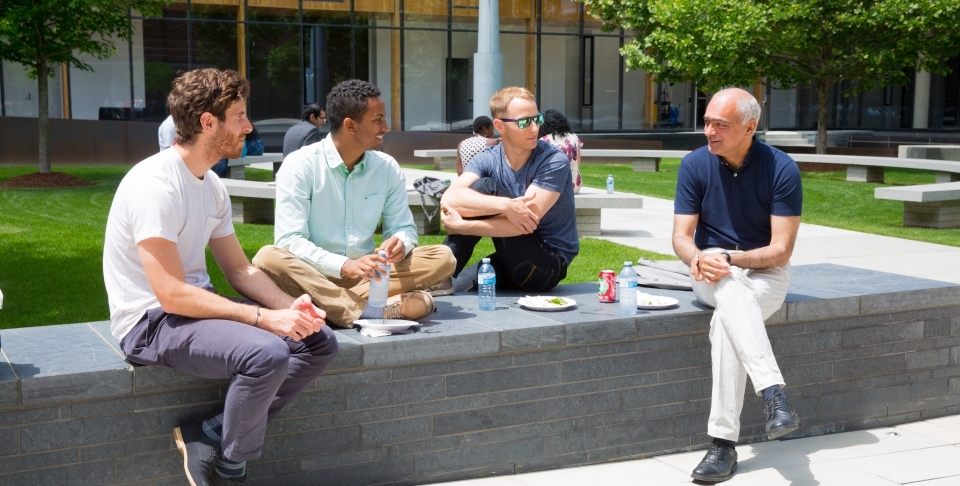 CIGI President Rohinton Medhora and staff enjoy a beautiful day in the CIGI campus courtyard over lunch.