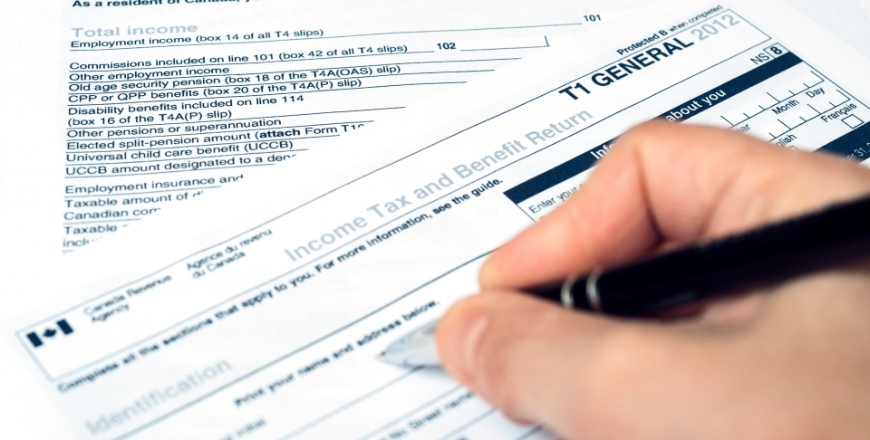 Filling out a Canadian T1 tax form. (Shutterstock)