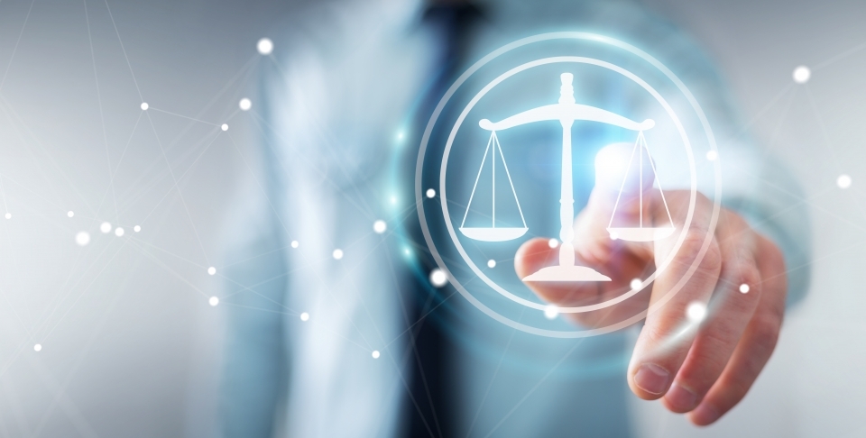 Businessman on blurred background using law protection right 3D rendering. (Shutterstock)