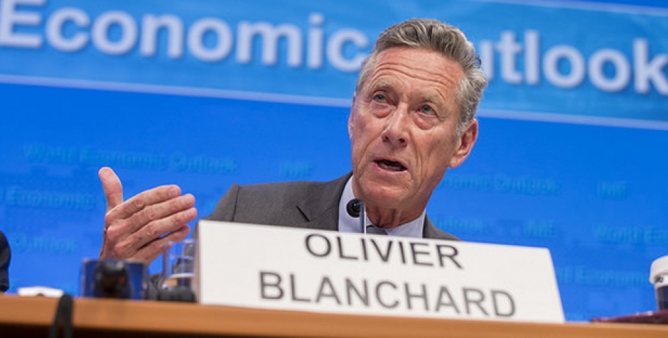 Olivier Blanchard speaks on a panel to discuss World Economic Outlook. (IMF Staff Photograph/Stephen Jaffe)