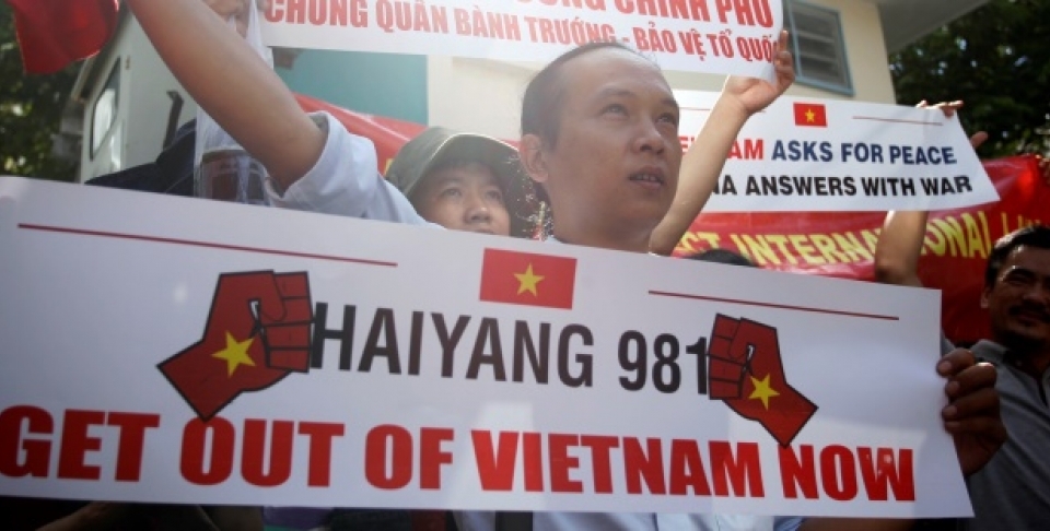 Vietnamese protesters hold banners during a protest rally against China outside the Chinese Consulate in Ho Chi Minh City, Vietnam, Saturday, May 10, 2014. (AP Photo)