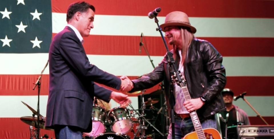 Republican presidential candidate, Mitt Romney shakes hands with musician Kid Rock at a campaign rally. (AP Photo/Gerald Herbert)