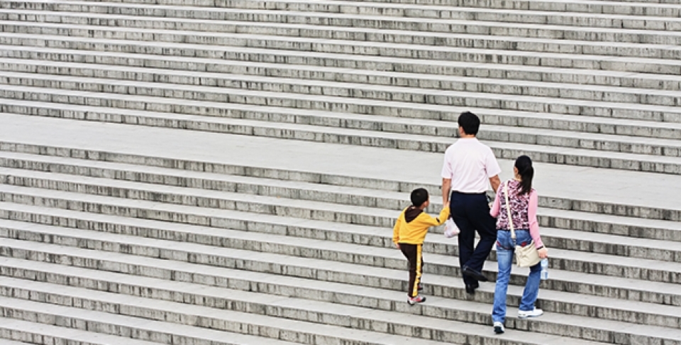 A family's way up on a staircase in May 2009 in Xian, China. (Shutterstock Image)