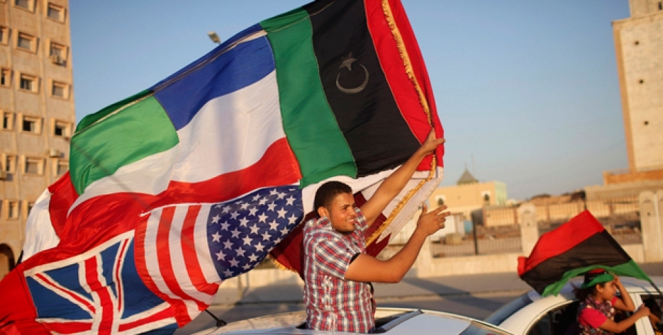 People celebrate the attack on Moammar Gadhafi's main military compound in Tripoli, in the rebel-held town of Benghazi, Libya, Tuesday, Aug. 23, 2011 (AP Photo/Alexandre Meneghini).