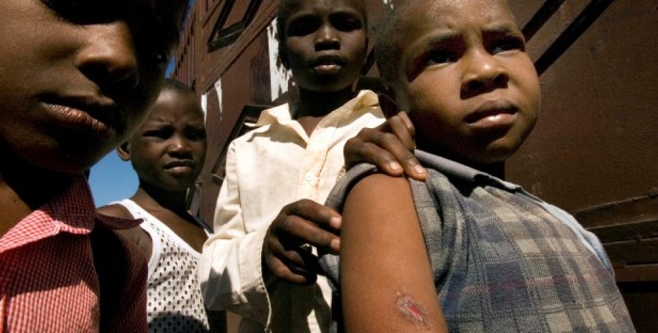 Several Haitian children show the wound a stray bullet caused during clashes between armed gangs and U.N. peace keepers at the slum of Cite Soleil, in Port-au-Prince (AP Photo/Ramon Espinosa).