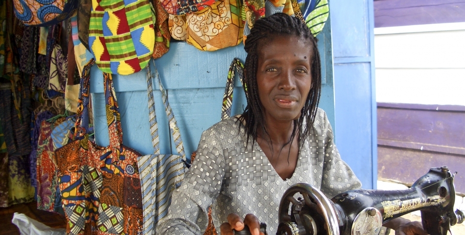 A seamstress works at a sewing machine in her newly opened shop in Cape Coast, Ghana. (Shutterstock)