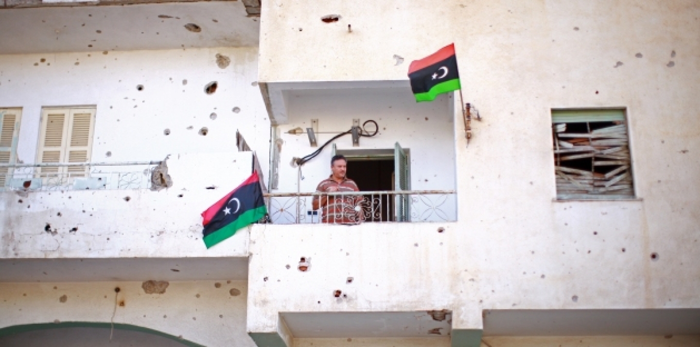 A man in Zawiya, Libya, watches during a visit to the town by Special Representative of the Secretary-General and Head of the UNSMIL, Ian Martin, November 2011. (UN Photo/Iason Foounten)