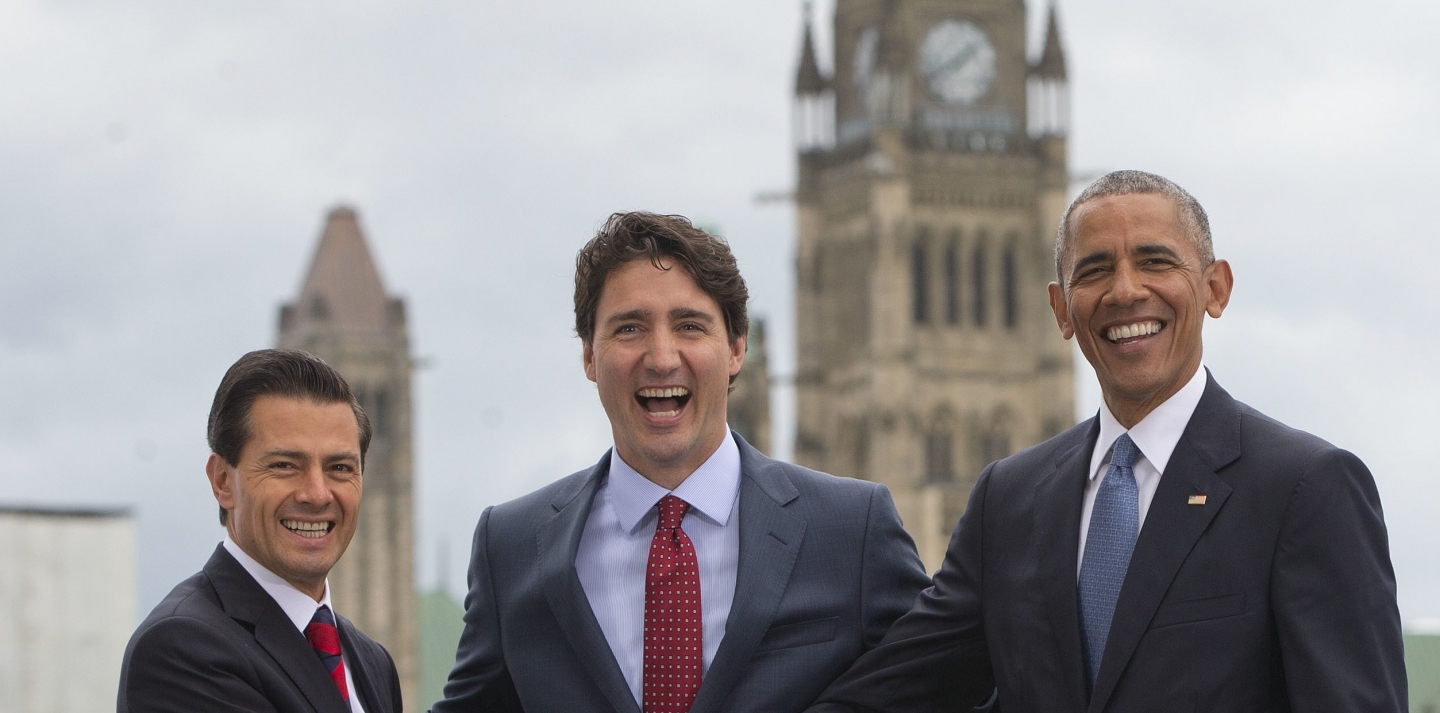 US President Barack Obama, Canadian Prime Minister Justin Trudeau and Mexican President Enrique Pena Neito in front of Parliament Hill on Wednesday, June 29, 2016. (AP Photo/Pablo Martinez Monsivais)