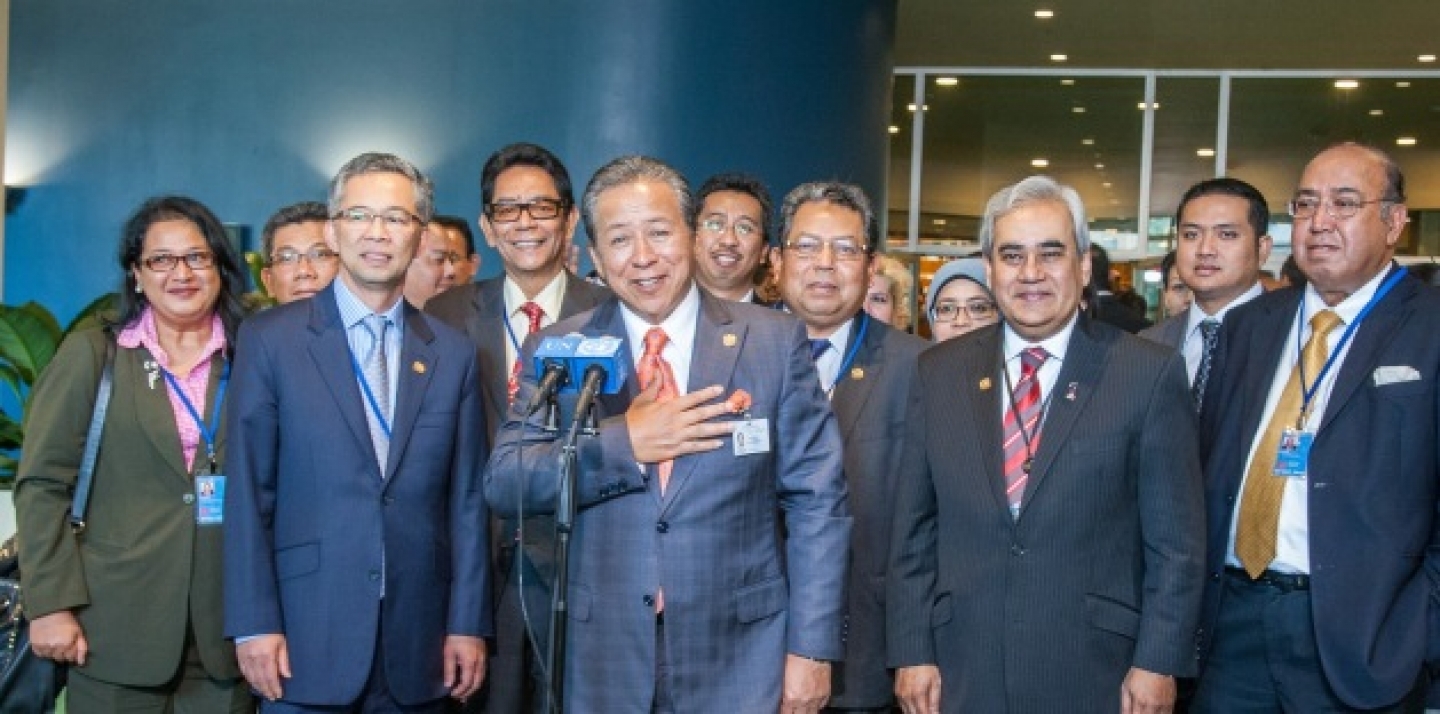 Dato Sri Anifah Aman (front centre), Minister for Foreign Affairs of Malaysia, speaks to journalists following his country’s election to a non-permanent seat on the Security Council, October 16, 2014. (UN Photo/Loey Felipe)
