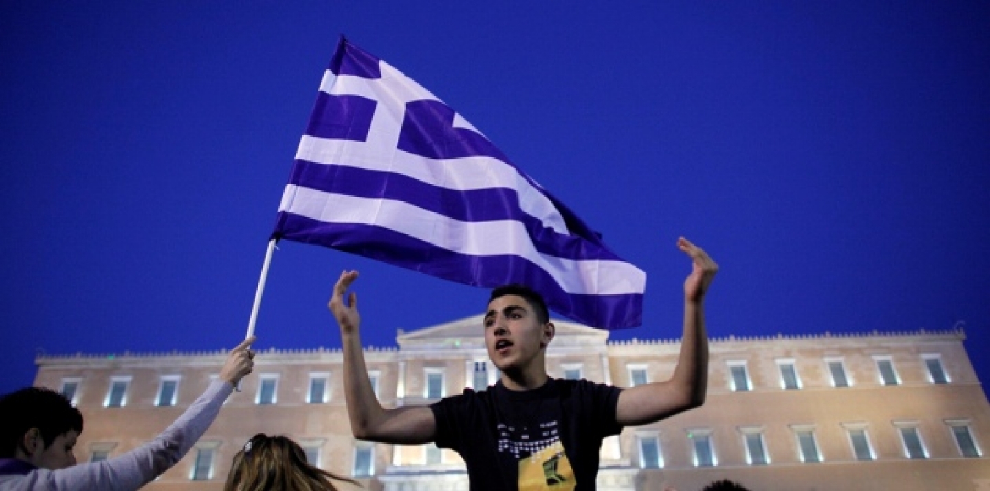 A young protester shouts slogans in front of the Greek parliament during a protest against austerity measures in Athens in June, 2011. (AP Photo/Kostas Tsironis)