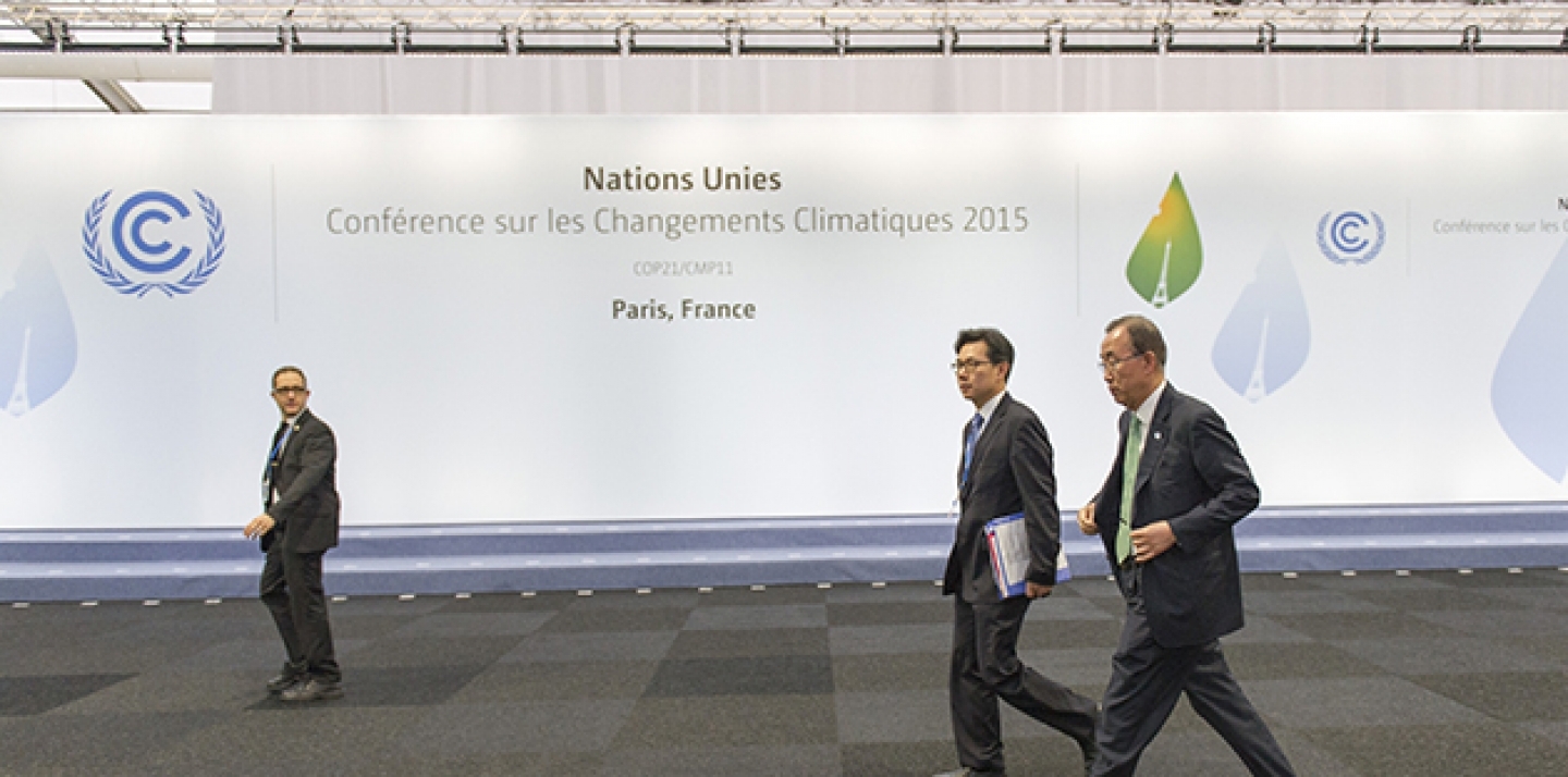 Secretary-General Ban Ki-moon (right) between meetings during the UN Climate Change Conference in Paris (COP 21), on November 30, 2015. (UN Photo/Rick Bajornas)