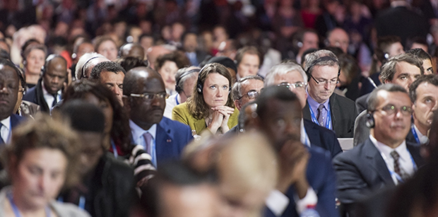 A shot from the “Comité de Paris”: Presentation of Draft Outcome Document at the UN Climate Change Conference in Paris, December 12, 2015. (UN Photo/ Mark Garten)