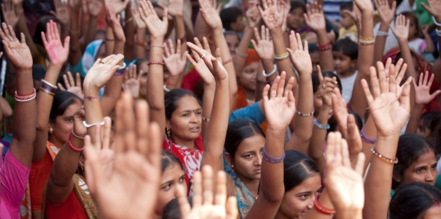 Community members in Gujarat, India, participate in discussions after watching video documentaries screened by the Self Employed Women's Association of India, 2010. (Gates Foundation)