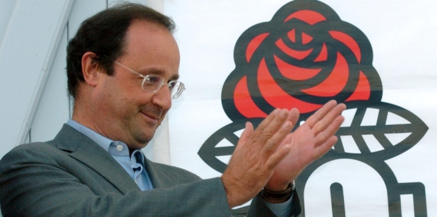 Francois Hollande, head of the French Socialist Party, applauds from the balcony of the Charentes Socialist Federation headquarters in La Rochelle, southwestern France, Thursday, Aug. 24, 2006 (AP Photo/Bob Edme).