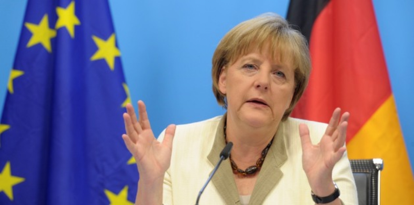 German Chancellor Angela Merkel speaks during a media conference after an EU summit of eurogroup members at the EU Council building in Brussels on Thursday, July 21, 2011. (AP Photo/Geert Vanden Wijngaert)