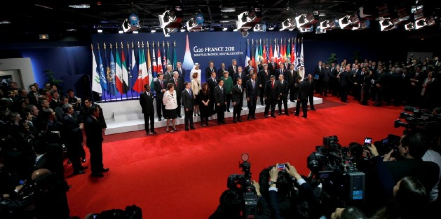 G20 leaders stand for a group photo at a G20 summit in Cannes, France on Thursday, Nov. 3, 2011 (AP Photo/Yves Herman, Pool).