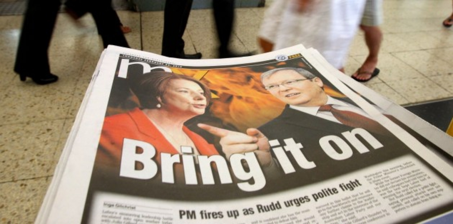 Photos of Australian Prime Minister Julia Gillard, left, and former Foreign Minister Kevin Rudd, are displayed on a newspaper at a train station Thursday, Feb. 23, 2012, in Sydney (AP Photo/Rick Rycroft).