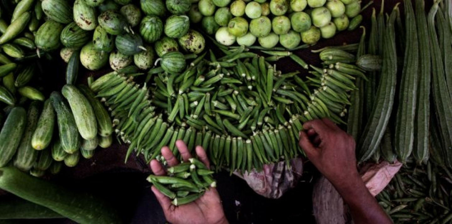 An Indian vendor arranges vegetables at his stall in Gauhati, India, Tuesday, May 15, 2012. India's inflation accelerated to a worse than expected 7.2 percent in April, on rising food and manufacturing prices. (AP Photo/Anupam Nath)