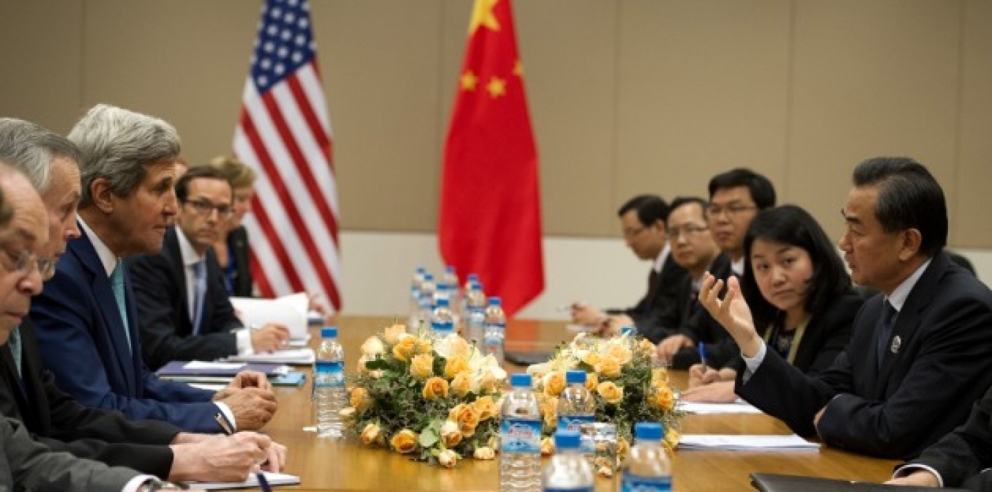 U.S. Secretary of State John Kerry talks with Chinese Foreign Minister Wang Yi during their bilateral meeting held on the sidelines of the 47th Association of Southeast Asian Nations foreign ministers' meeting in Myanmar, on August 9 2014. (AP Photo/Nicolas Asfouri, Pool)