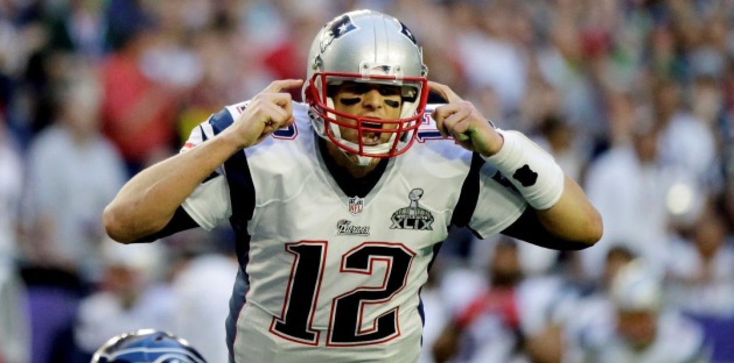 New England Patriots quarterback Tom Brady (12) calls a play against the Seattle Seahawks during the first half of NFL Super Bowl XLIX football game Sunday, Feb. 1, 2015, in Glendale, Ariz. (AP Photo/David Goldman)