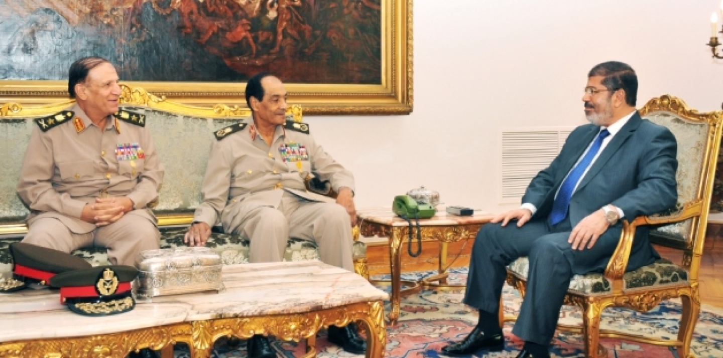 Sami Enan, left, Hussein Tantawi, center, and Egyptian President Mohamed Morsi meet at the Presidential Palace in Cairo, Egypt, Tuesday, Aug. 14, 2012. (AP Photo/Middle East News Agency, HO)