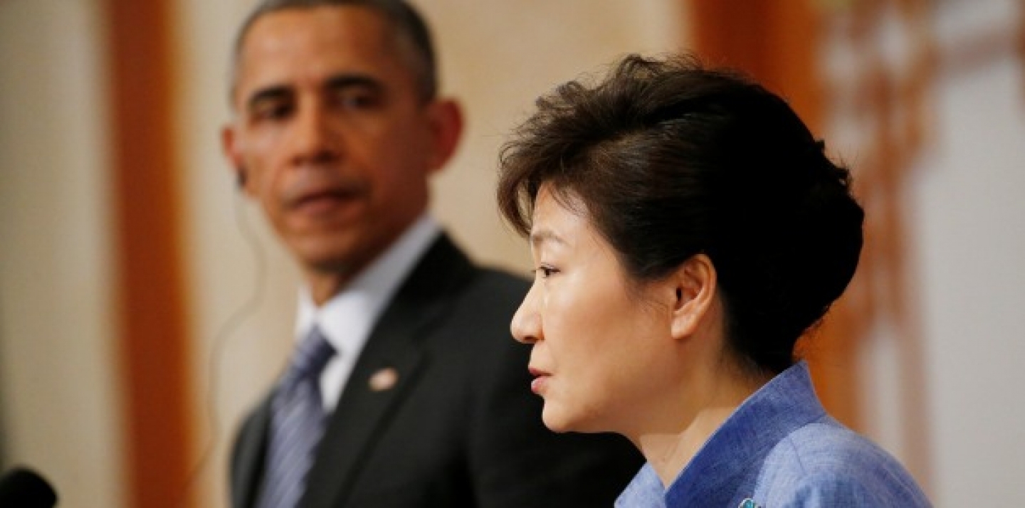 U.S. President Barack Obama looks towards South Korean President Park Geun-hye as she answers a question during a joint news conference at the Blue House in Seoul, South Korea, Friday, April 25, 2014. (AP Photo/Charles Dharapak)