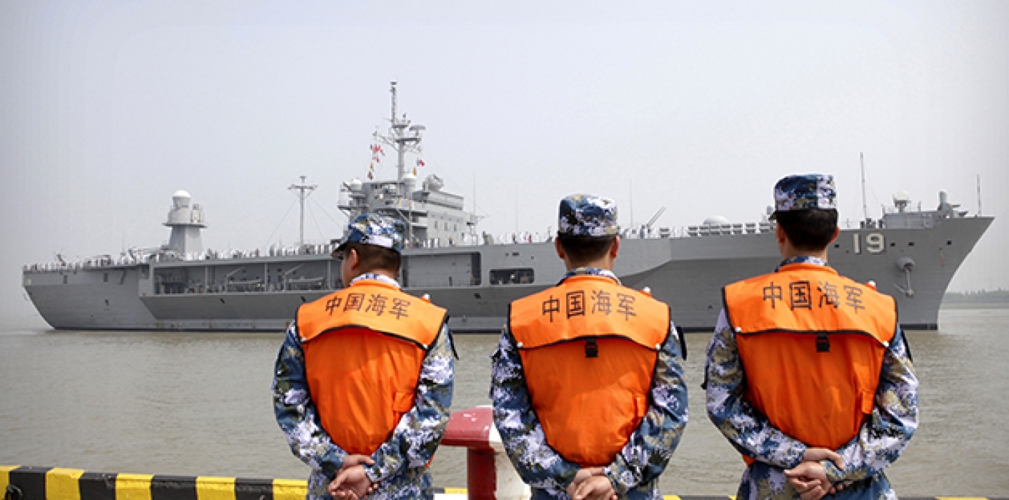 In this May 6, 2016, file photo, soldiers from the Chinese People's Liberation Army (PLA) Navy watch as the USS Blue Ridge arrives at a port in Shanghai. (AP Photo, File)